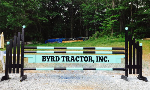 Byrd Tractor sponsored horse jump with Dapple Equine horse jump cups