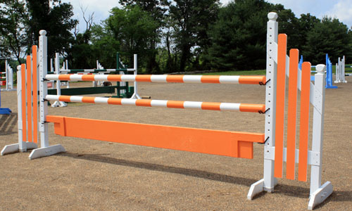 orange and white horse jump with Dapple Equine horse jump cups